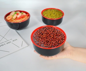 Three-piece black and red bowl set displaying realistic food models for photography