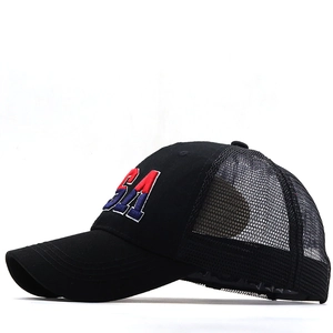 Close-up of high-quality USA embroidery and breathable mesh on this black trucker cap