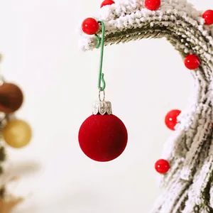 Red flocked Christmas ball ornaments with silver caps on snowy branch, 30pcs set