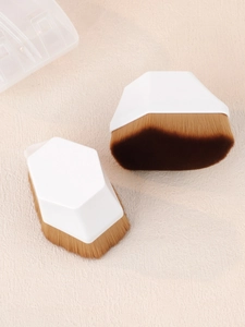 Detail of two hexagonal foundation brushes with dense gradient bristles and a clear storage case