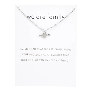 Silver heart and arrow necklace displayed on a white family message gift card