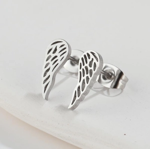Retro angel wing stud earrings in silver-toned metal with detailed feather texture