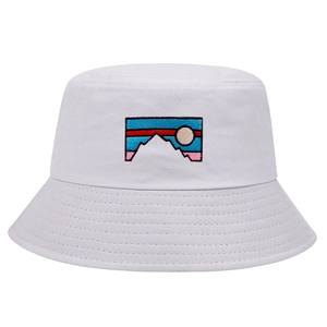 White cotton bucket hat featuring colorful mountain sunrise embroidery for outdoors