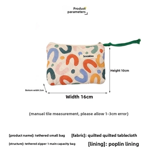 Floral quilted mini pouch measuring 16x10x2cm with green cord zipper and soft fabric