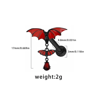 Detail view of a gothic red bat earring with a teardrop gem and 17mm size dimensions