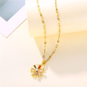 Elegant 18K gold daisy necklace with colorful zircon pendant on warm beige background
