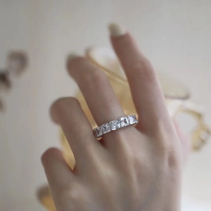 Macro detail of 925 silver eternity ring featuring square-cut sparkling carbon diamonds