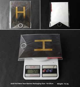 Detail of Happy New Year banner showing black and gold letter H and product packaging size