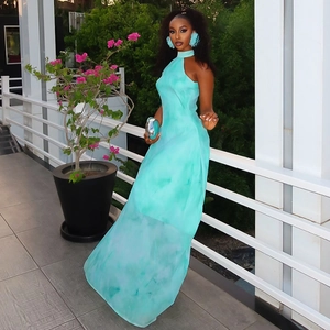 Detail of tiffany blue tie-dye halter dress with lightweight fabric and sheer hemline