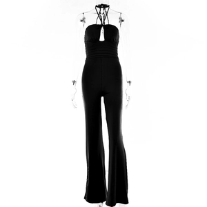 Detail view of black halter jumpsuit featuring a cutout chest and high waist fit