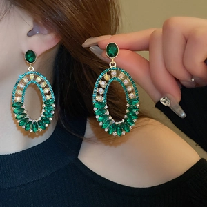 Vintage oval emerald earrings with multi-color diamonds in a French luxury style