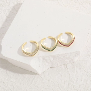 Three V-shaped 14K gold plated stacking rings with clear, green, and red zircon stones