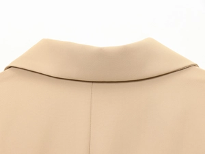 Close-up of khaki blazer collar showing detailed twill fabric texture and stitching