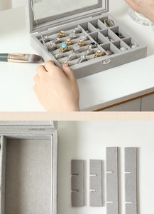 Close-up of gray velvet jewelry organizer box with adjustable dividers and transparent lid