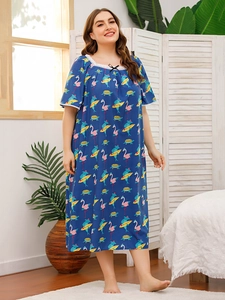 Detail of square neckline with white lace trim and bow on flamingo print nightdress