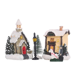 Detailed Christmas miniature scene with snow-covered houses, vintage lamp, and carriage