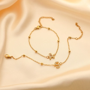 Gold stainless steel beaded bracelet with rhinestone letter pendants A and S