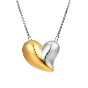 Minimalist heart pendant necklace in gold and silver tones with a sleek snake chain