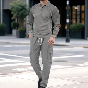 Men's casual grey two-piece tracksuit featuring textured long sleeve polo and matching trousers
