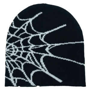 Classic black knitted beanie featuring a bold white spider web jacquard pattern print