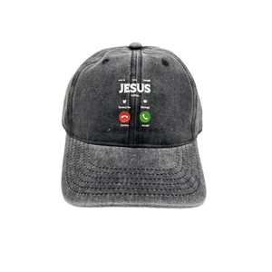 Close-up of washed cotton baseball cap featuring 'JESUS calling' digital print detail