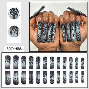 Halloween gray black gradient press-on nails with spider web patterns and blue rhinestones