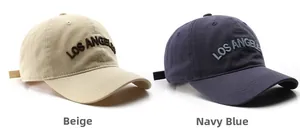 Detailed comparison of beige and navy Los Angeles embroidered cotton baseball caps