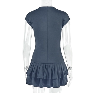 Close-up of the back view showing the layered ruffle hem and slim waist of the blue mini dress