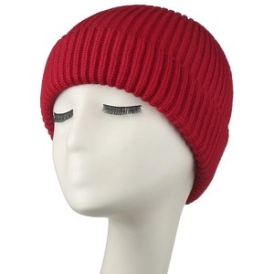 Close-up view of a vibrant red ribbed knit beanie hat for winter warmth and comfort