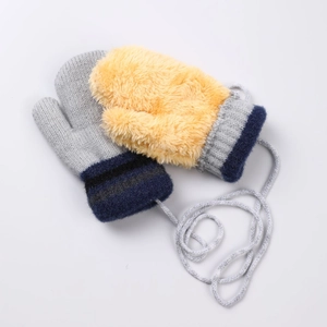 Detailed view of color-block winter gloves with plush texture and connecting string