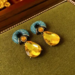 Vintage water drop earrings with blue rhinestones and yellow pear-shaped crystal