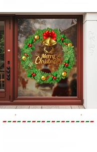 Détail d'un sticker de Noël pour fenêtre avec couronne verte, nœud rouge et cloches