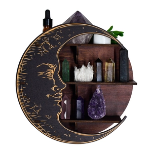 Detailed view of bohemian crescent moon wooden shelf with carved sun face and crystal display