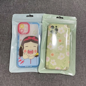 Premium packaging bags with floral and cartoon phone cases in clear sealable plastic