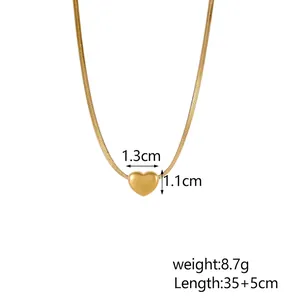 Detail view of heart pendant with 1.3cm size and flat snake chain gold necklace