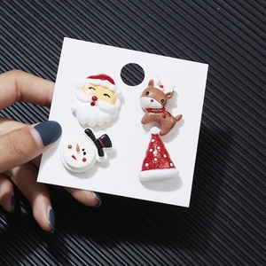 Christmas set featuring Santa, reindeer, snowman and hat stud earrings on display card