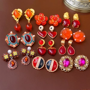 Collection of 12 pairs of vintage style earrings with gold finish and colorful resin gems