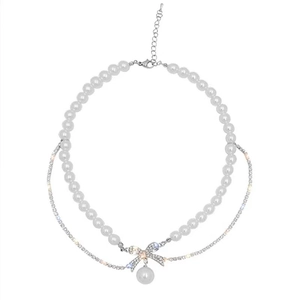 Elegant double-layered pearl and rhinestone bow necklace with a vintage French style pendant