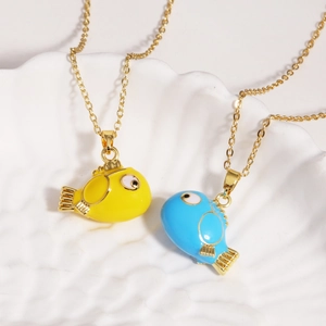 Detail of yellow and blue enamel fish pendants on elegant golden stainless steel chains