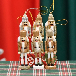 Set of 6 gold and silver wooden nutcracker soldier ornaments with festive glitter finish