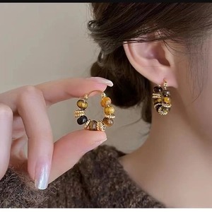Ethnic vintage hoop earrings with tiger eye stone beads and golden rings for women