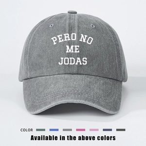 Detail of gray washed cotton baseball cap featuring PERO NO ME JODAS embroidery