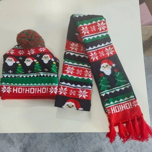 Close-up of LED Christmas knit hat and scarf set with Santa and HO!HO!HO! patterns