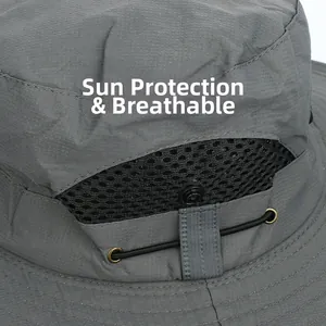 Detail of breathable honeycomb mesh and ripstop fabric on a dark grey sun hat