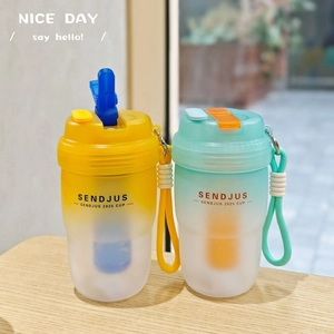 Detail view of two gradient frosted portable cups with straw lids and woven carry straps