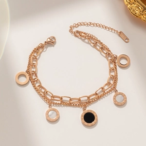 Double-layered 18K gold plated titanium bracelet featuring Roman numeral shell pendants