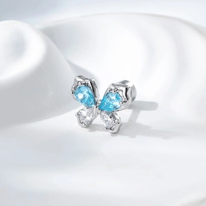 Silver butterfly cartilage piercing stud with blue and white marquise-cut zircon stones
