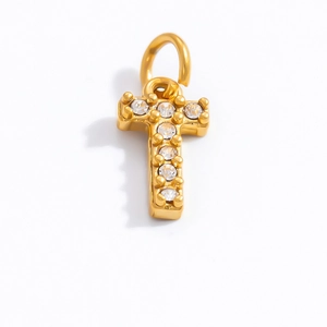 Close-up of a gold-plated letter T pendant with sparkling white cubic zirconia stones