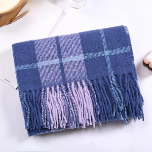 Detailed view of the navy blue and purple plaid cashmere-feel scarf with long tassels