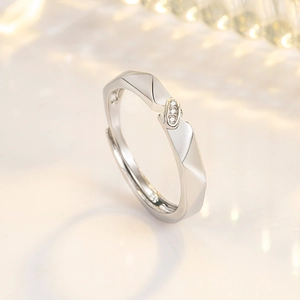 Minimalist geometric faceted silver ring for women with micro-set zircons and open band